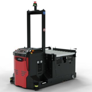 Vehículo de transporte sin conductor I-MATIC CT core de Linde MH para la recogida y el transporte de mercancías desde un sistema de transporte.